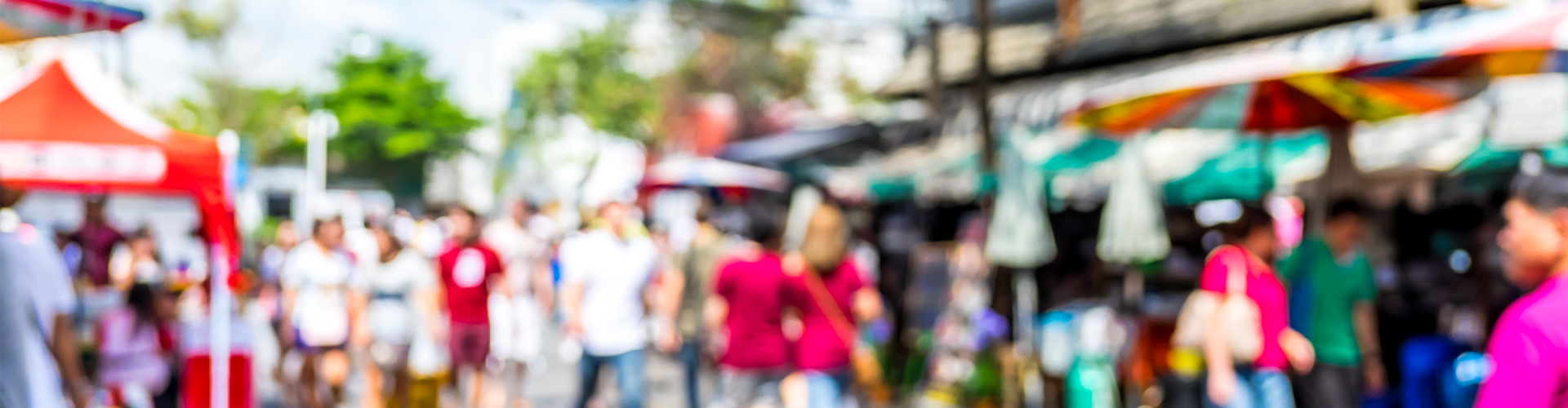 Blurred background : people shopping at market fair in sunny day at Highland Knolls
